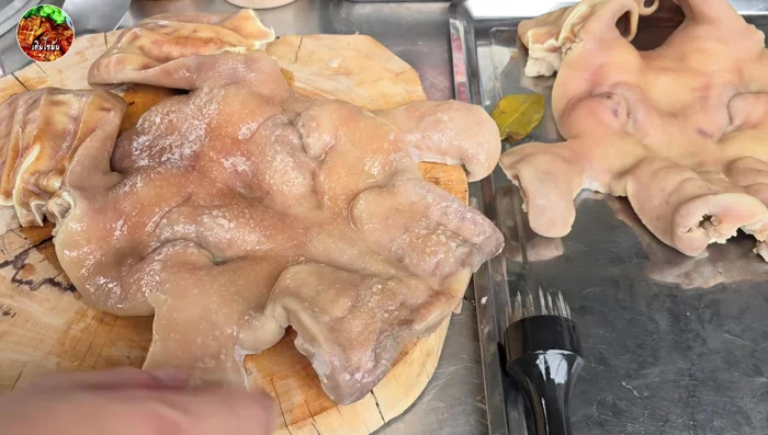 Prick the pig mask all over to help it puff up and become crispy.