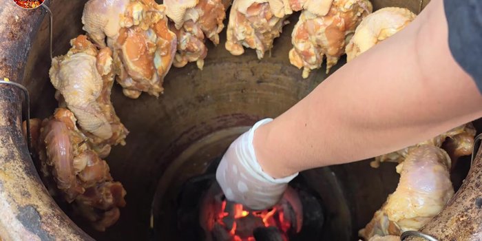 Place the marinated chicken bones in the clay pot or on the grill.