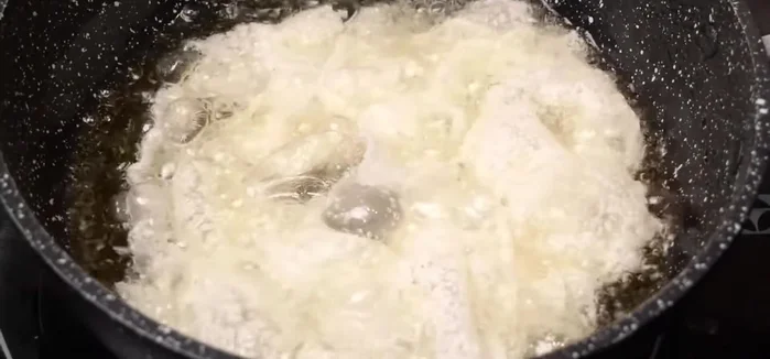Allow the noodles to cook together, ensuring they soften and become slightly crispy. This may take some time.