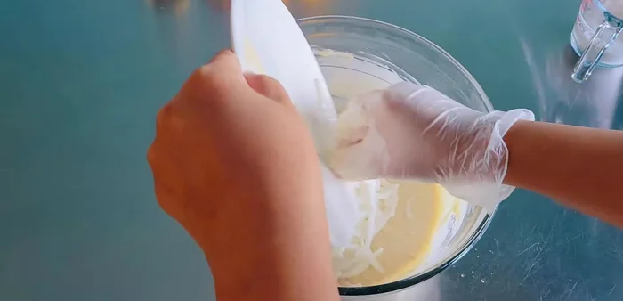 Stir in young coconut (1 can/200 grams) and white sesame seeds (2 tablespoons). Mix until just combined.