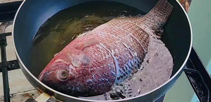 Heat vegetable oil in a pan over medium heat. Add the fish and fry until golden and crispy. Remove and set aside.