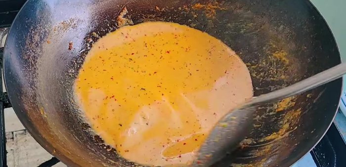 Add water (or more coconut milk) to adjust the consistency. Add coconut sugar, fish sauce, and seasoning powder to taste.