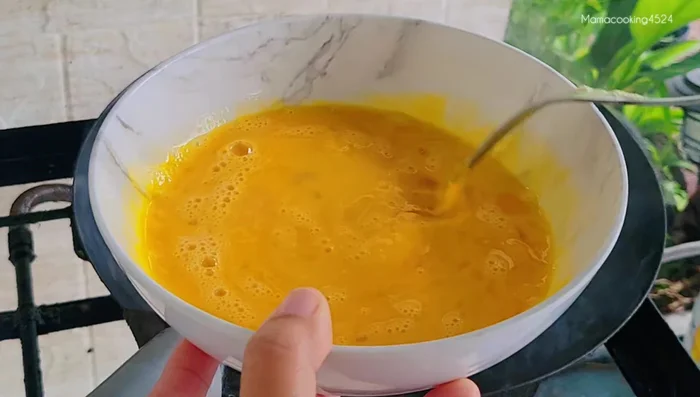 Add eggs and scramble lightly.