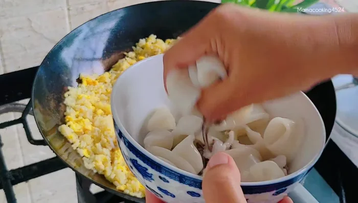 Add squid, ensuring it's squeezed dry to prevent sogginess.
