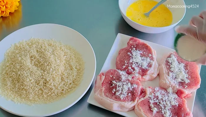 Coat the pork: Sprinkle flour on both sides of the pork. Dip in egg, then coat with breadcrumbs (repeat egg and breadcrumbs for thicker coating).