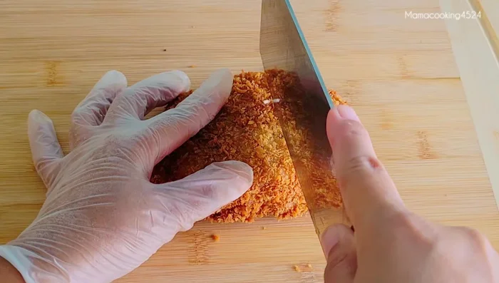 Assemble the Katsu Don: Cut the fried pork into pieces. In a small pan, heat the prepared soup and add a portion of instant noodles. Bring to a boil.