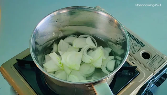 Prepare the soup: In a pot, add water, onions, and dried fish flakes. Simmer over medium heat for about 5 minutes.