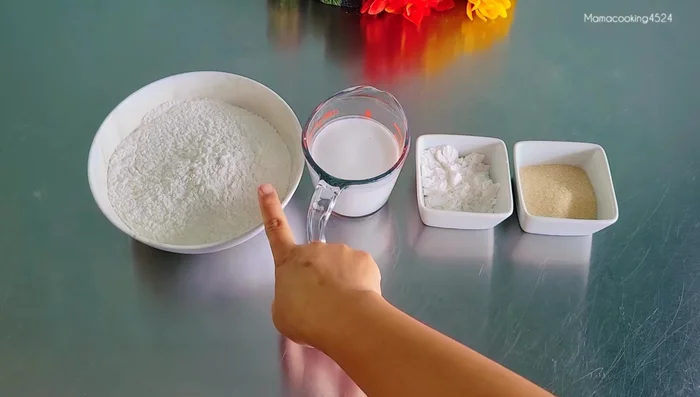 Prepare the dough: Mix glutinous rice flour, rice flour, and sugar. Heat coconut milk for 1 minute in the microwave.