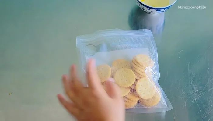 Prepare crackers: Roughly crush crackers and mix with melted unsalted butter in a bag for even coating.