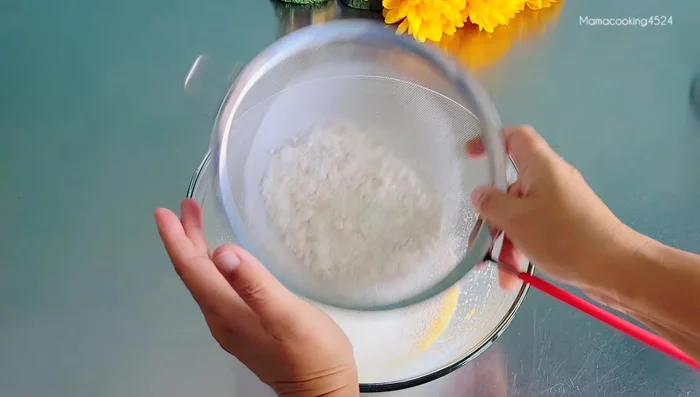 Add the dry ingredients to the wet ingredients. Initially mix with a utensil until it starts to clump together, then use your hands to knead.