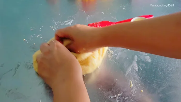 Add 1 tablespoon of corn oil (or other oil) and knead until the dough no longer sticks to your hands.