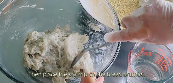 Shape the shrimp mixture into large balls. Roll in breadcrumbs.