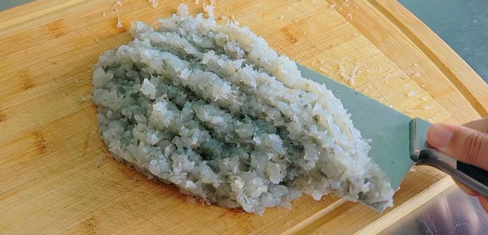 Place the chopped shrimp in a container. Add salt and ground pepper.