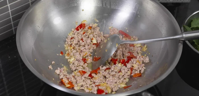 Add glass noodles and stir-fry until heated through.