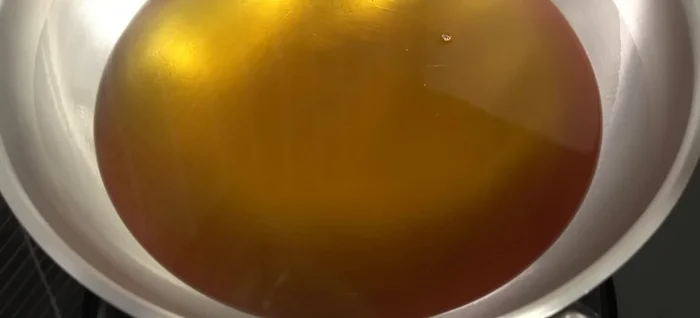Heat oil in a pan until very hot (oil will boil and steam will rise).