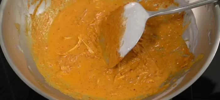 Season the Chu Chee sauce with palm sugar and fish sauce. Add thinly sliced galangal.