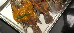Crispy Fried Nile Tilapia with Chu Chee Curry Sauce: A Thai Restaurant Recipe