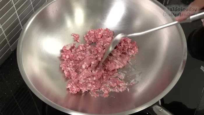 Add the minced pork to the hot pan and stir-fry until cooked through and releases its own oil. (Medium heat)