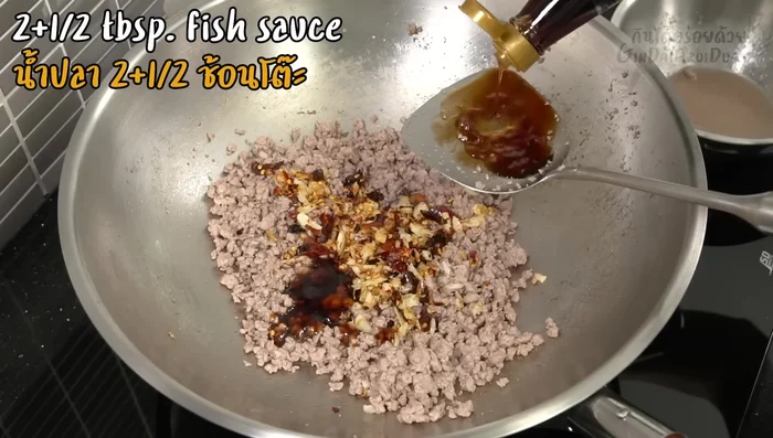 Season with oyster sauce, fish sauce, and sugar. Stir well.