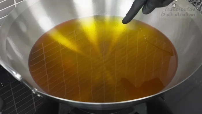 Fry the sea bass: Heat oil in a pan until very hot (oil vapor appears). Carefully add the fish and fry until golden brown and crispy (about 8-10 minutes per side).