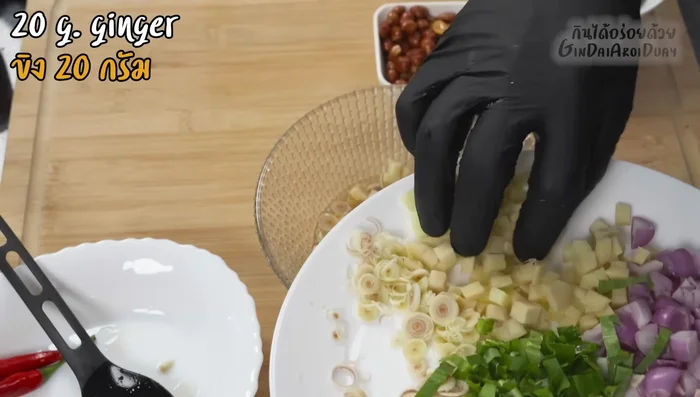 Assemble the dish: Serve the fried sea bass with herbal dressing.