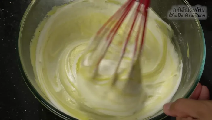 Gently fold the beaten egg whites into the batter in three additions.