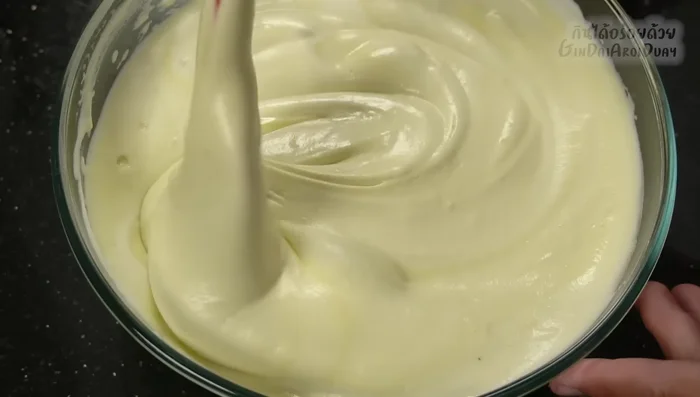 Preheat oven to 150-160°C (300-320°F). Pour batter into prepared baking tray lined with parchment paper. Gently tap the tray to remove air bubbles.