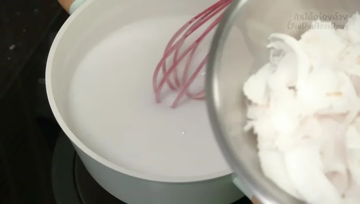 Once thickened, stir in remaining coconut meat. Let cool completely.