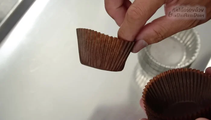 Pour batter into cupcake molds, filling almost to the brim.