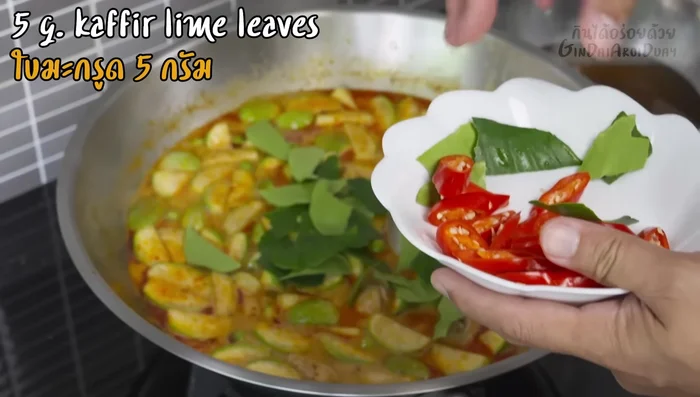 Add kaffir lime leaves and simmer (686.8).