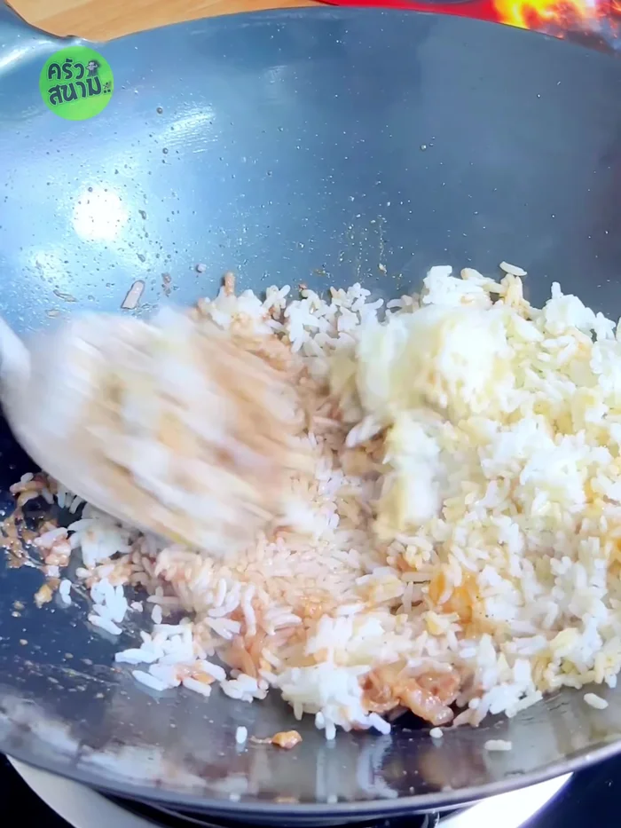 Stir-fry until the rice changes color.