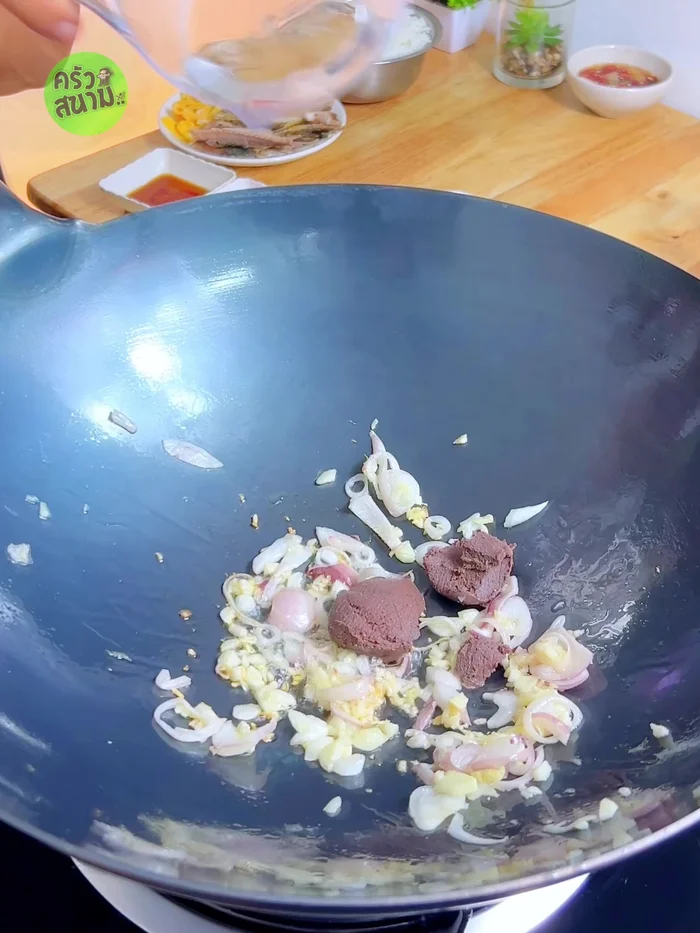 Add shrimp paste and water, stir-fry until well blended and thickened.