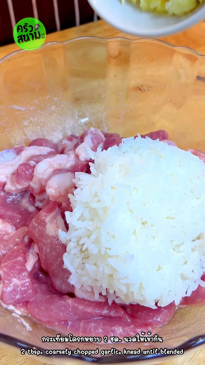 Add cooked rice and crushed garlic. Knead until well blended.