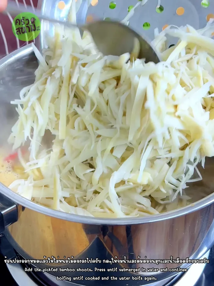 Add the prepared pickled bamboo shoots and press them down to submerge them in the soup. Continue to boil until the bamboo shoots are cooked.