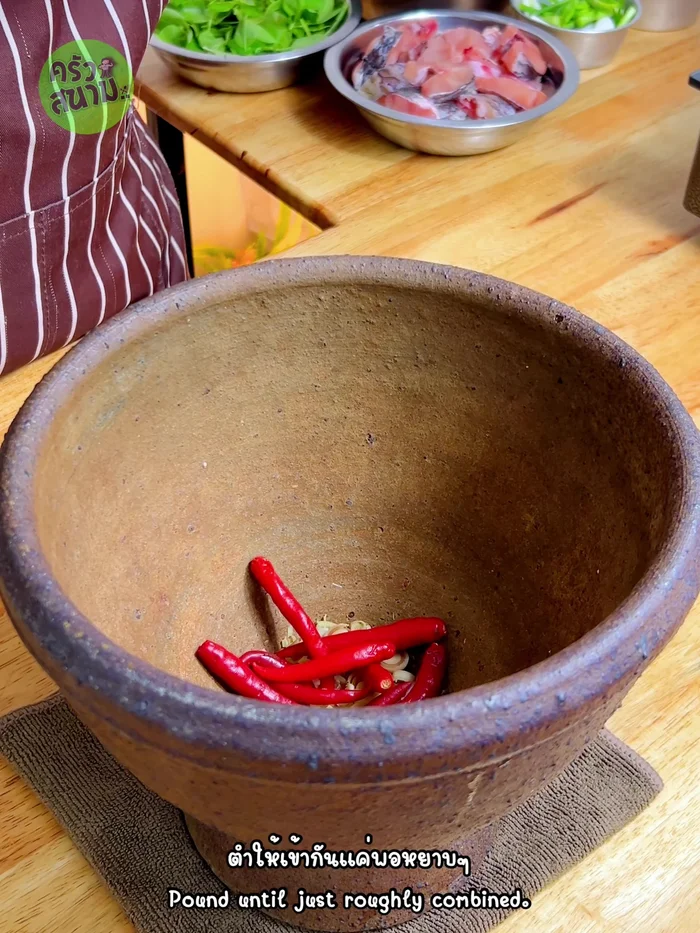 Prepare the curry paste: Pound together salt, lemongrass, chili peppers, and shallots until coarsely ground.