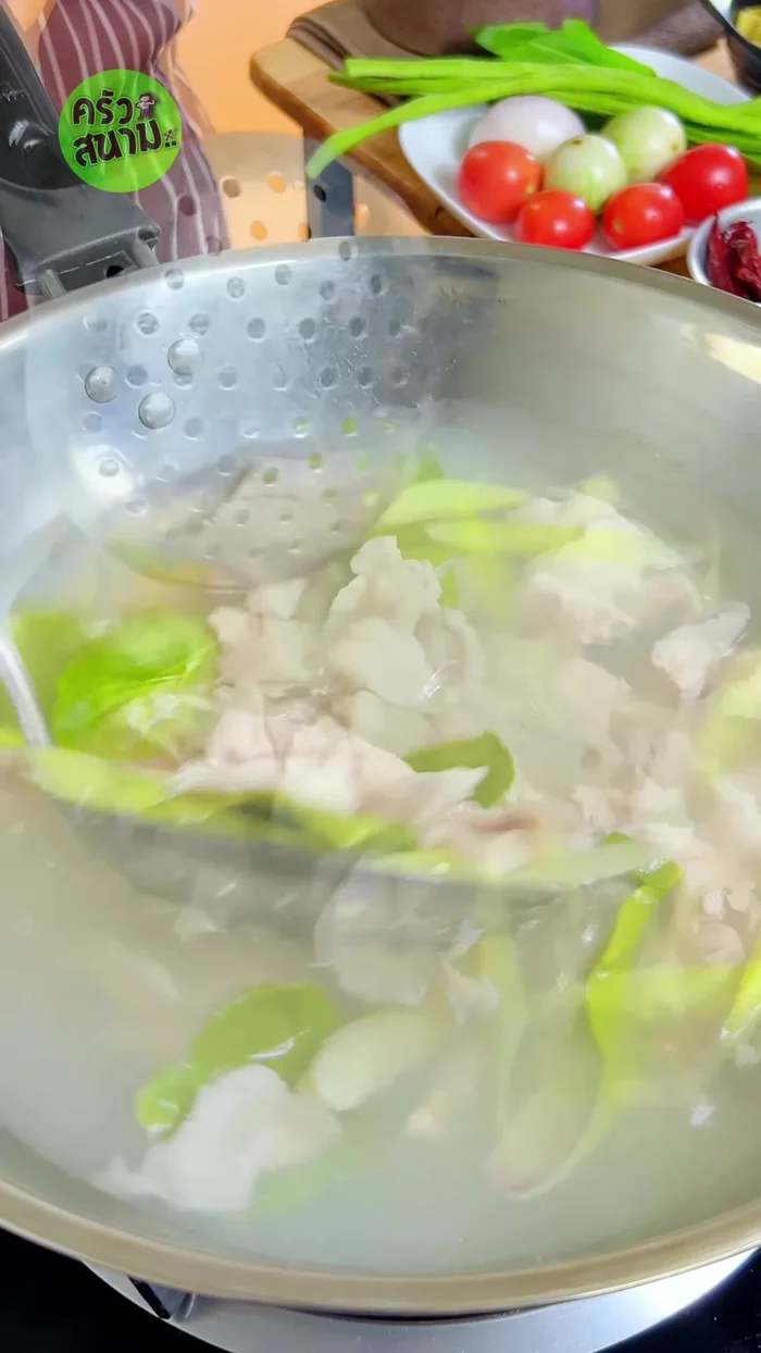 Remove the pork from the boiling water and set aside. Discard the lemongrass and kaffir lime leaves.