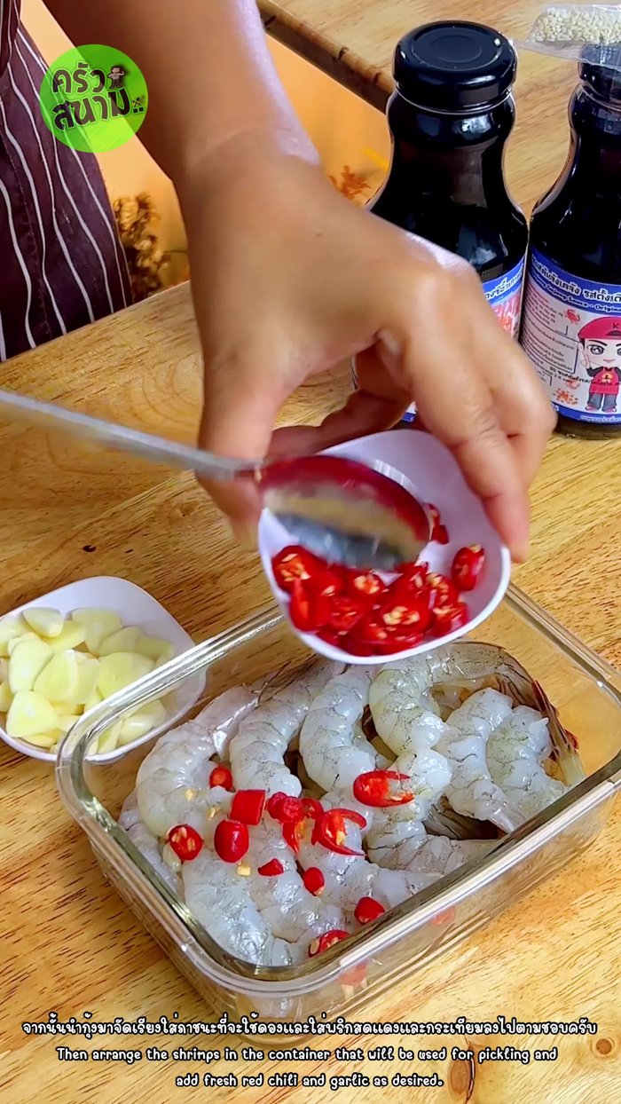 Add sliced red chili peppers and garlic.