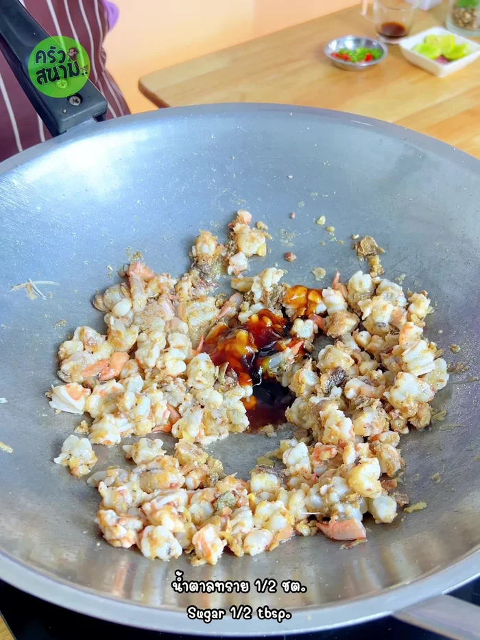Season with oyster sauce, sugar, and white vinegar. Stir-fry to combine.