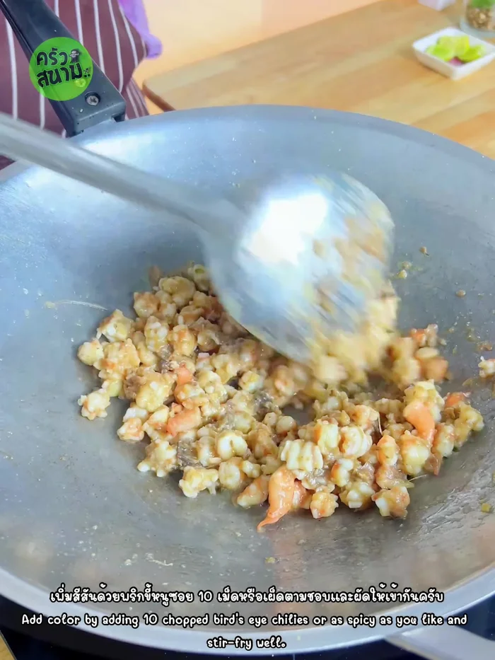 Add chopped chili peppers (to taste) and stir-fry until everything is well mixed.