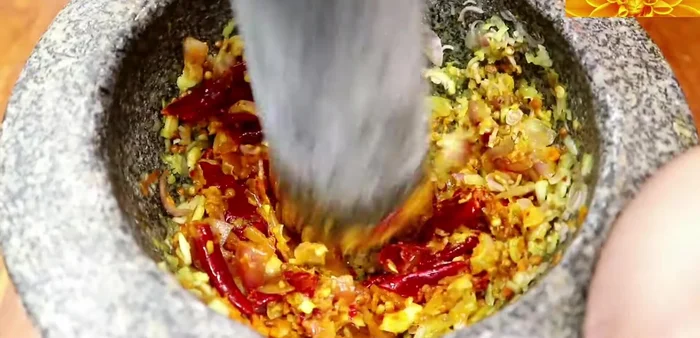 Marinate the fish: Mix fish sauce, lime juice, and prepared aromatics (garlic, ginger, chili, lemongrass, shallots, etc.). Marinate the Tilapia in this mixture for at least 15 minutes.