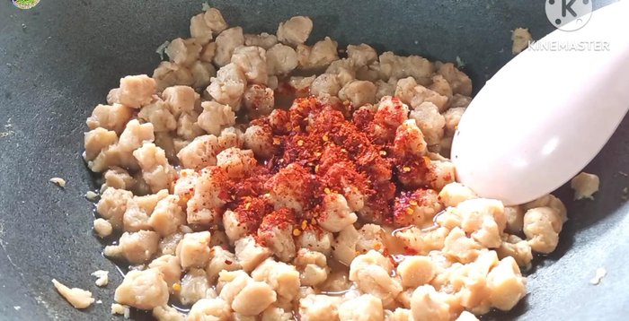 Add chili powder and freshly roasted rice.