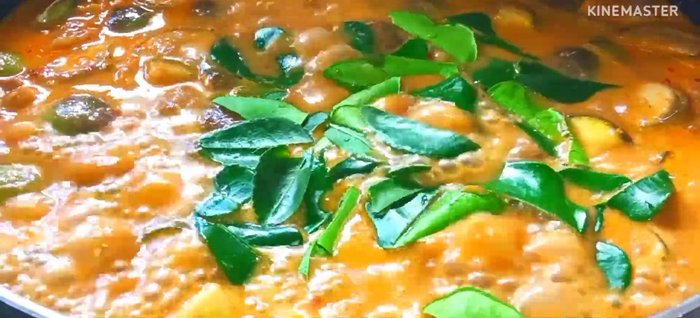 Add torn kaffir lime leaves and mix well.