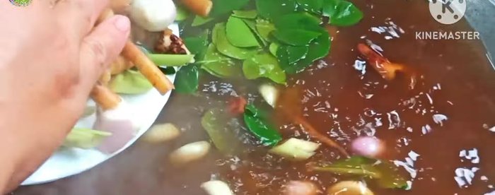 Add all herbs (galangal, lemongrass, kaffir lime leaves, coriander root, shallots, garlic). Bring to a boil.