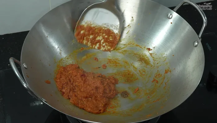 Stir-fry until the curry paste thickens. Add more coconut milk.