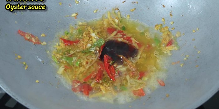 Add oyster sauce, fish sauce, brown sugar (optional), and torn kaffir lime leaves; stir-fry until fragrant.