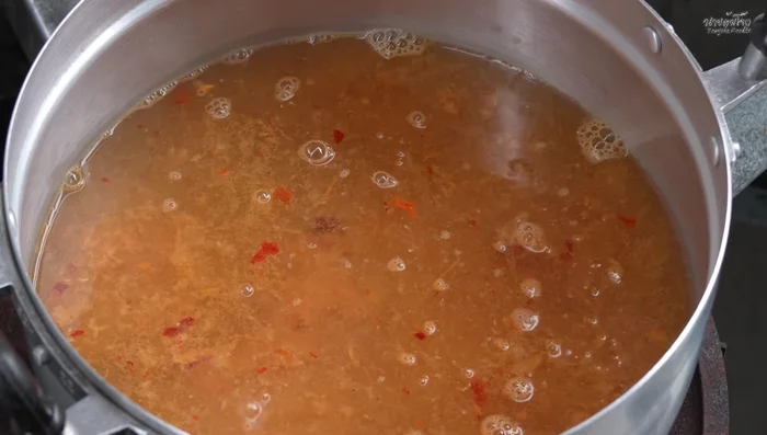 Heat the curry paste mixture and bring to a boil.