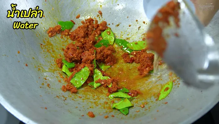 Add water (or bone broth) to dissolve the curry paste. Bring to a boil.