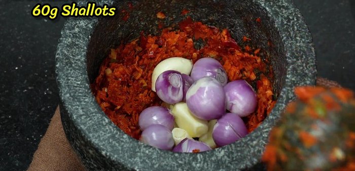 Add garlic and shallots to the pounded mixture, then finally shrimp paste. Mix well.