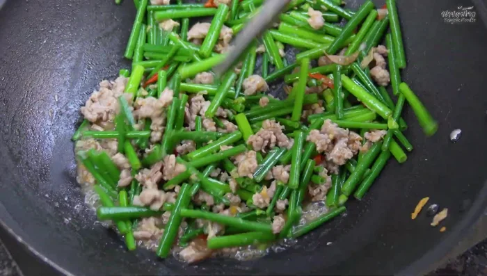 Stir-fry until the cauliflower is crispy and the flavors are well blended. Avoid overcooking.