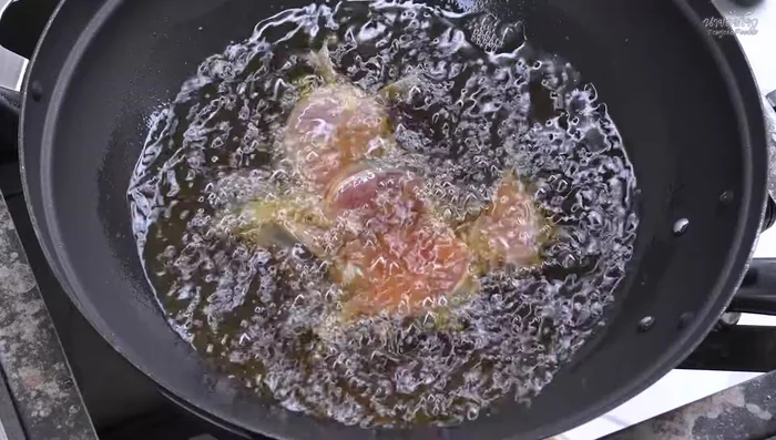 Prepare the catfish: Cut the catfish into pieces, season with salt, and let it dry. Fry the catfish until golden brown and crispy over medium heat.